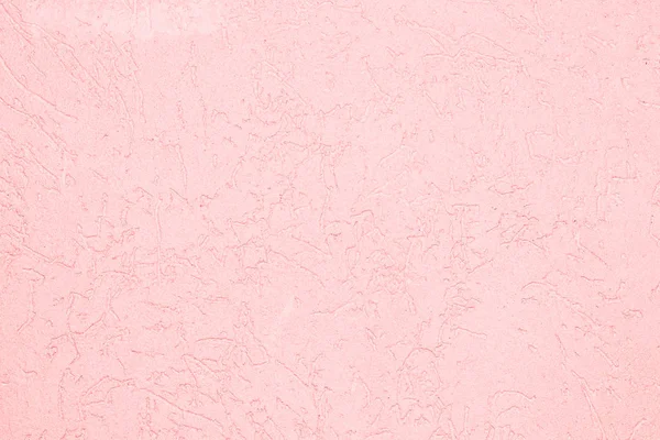 The pink texture of the surface of the wall covered with decorative plaster of the woodworm type, close-up architecture abstract background — Stock Image Pink Texture Surface Wall Covered Decorative Plaster Woodworm Type Close Stock Photo