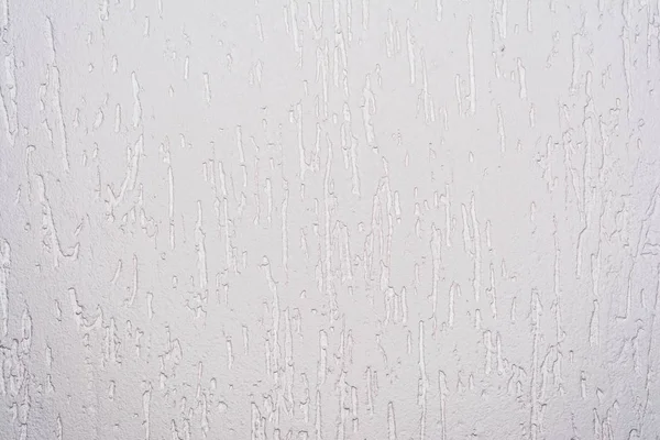 The pink texture of the surface of the wall covered with decorative plaster of the woodworm type, close-up architecture abstract background — Stock Image Pink Texture Surface Wall Covered Decorative Plaster Woodworm Type Close Stock Picture