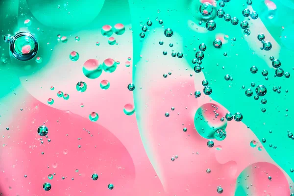 Water and oil bubble red green background. Macro shot of beautiful water and oil bubble background , with small and big bubbles