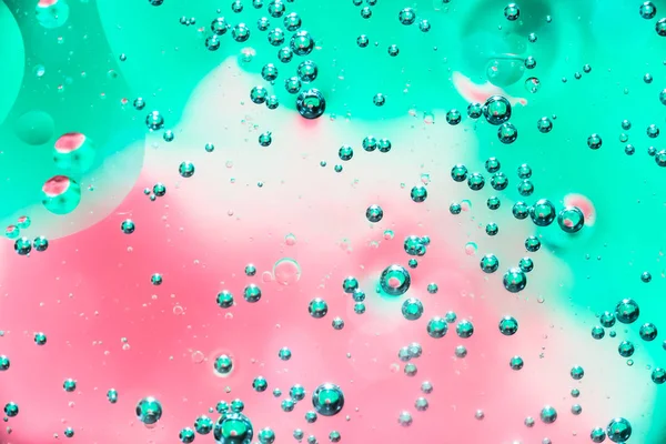 Water and oil bubble red green background. Macro shot of beautiful water and oil bubble background , with small and big bubbles