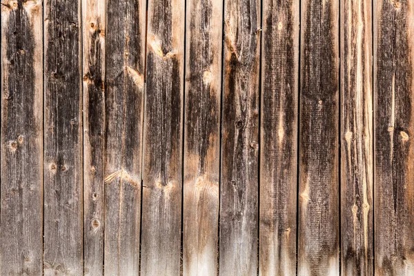 Painéis antigos verticais intemperizados, textura de painéis de madeira antigos escuros, fundo de abstração de decoração — Fotografia de Stock