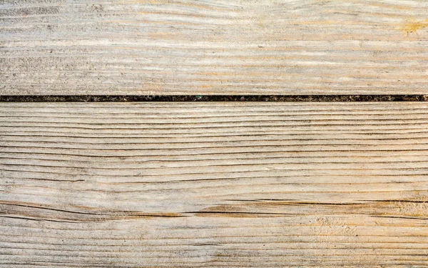 Konsistens av en gammal trämur, gammalt torkat trä med en massa sprickor och peeling fibrer, närbild abstrakt bakgrund — Stockfoto