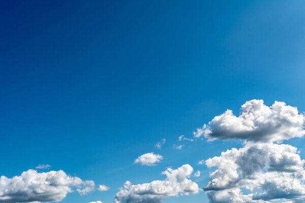 White, Fluffy Clouds In Blue Sky. Abstract Background From Clouds