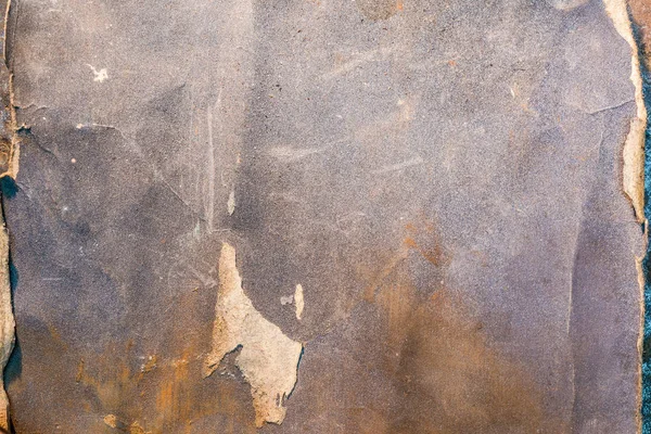 Slitna textur av sandpapper, närbild abstrakt bakgrund — Stockfoto