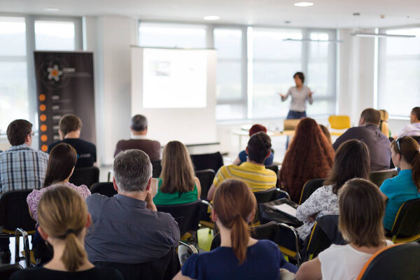 Speaker giving presentation on business conference.