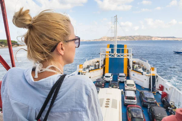 Woman on ferry boat trip to their summer vacations island destination. — Stock Photo, Image