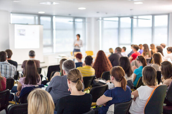Speaker giving presentation on business conference.