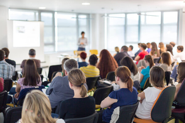 Speaker giving presentation on business conference.