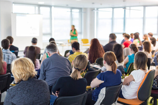 Speaker giving presentation on business conference.