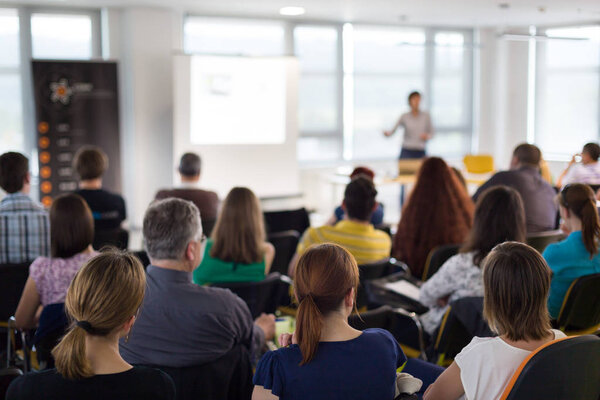 Speaker giving presentation on business conference.