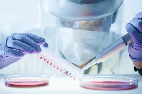 Scientist working in the corona virus vaccine development laboratory research with a highest degree of protection gear. — Stock Photo, Image