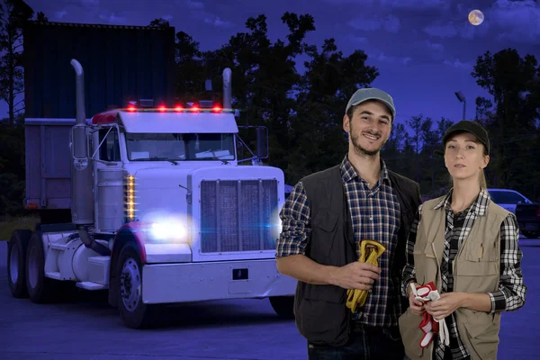Young couple truck drivers traveling in the night