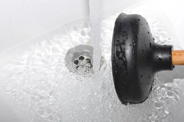 Plunger and clogged sink. — Stock Photo, Image