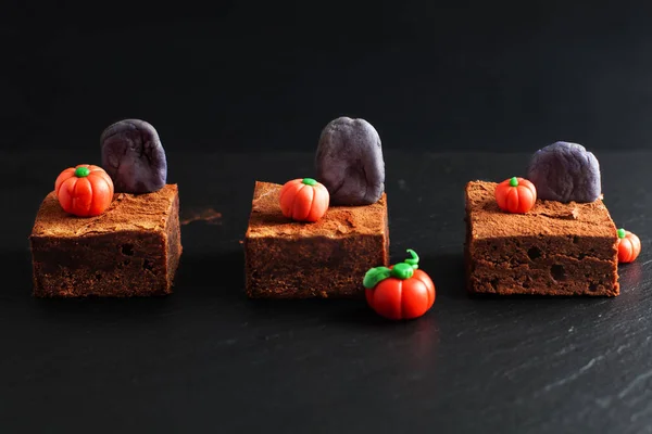Halloween food idea Homemade organic fudge and crispy brownies with fondants pumpkins on top
