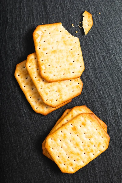 Food Appetizer Salted Crackers Black Slate Board Copy Space — Stock Photo, Image