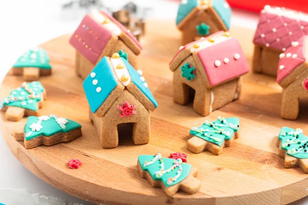 Holiday food DIY pastel Christmas Cookies, Gingerbread Houses, and Christmas tree for gift or party