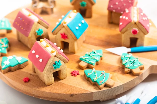 Holiday food DIY pastel Christmas Cookies, Gingerbread Houses, and Christmas tree for gift or party