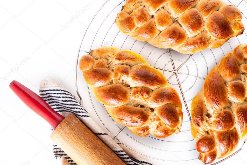 Homemade food concept fresh baked bread braid challah dough on w