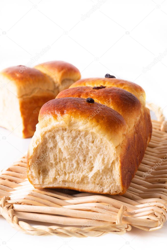 Food Baking concept Fresh baked organic homemade soft milk loaf bread on Wicker bread tray 