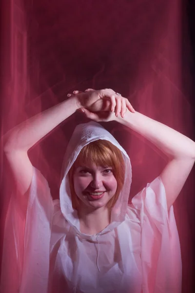 Portrait art of a young girl in white clothing with a hood, blur in motion.