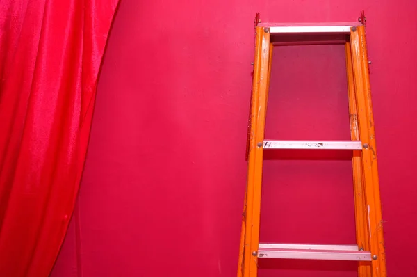 Orange Metal Ladder Red Wall — Stock Photo, Image