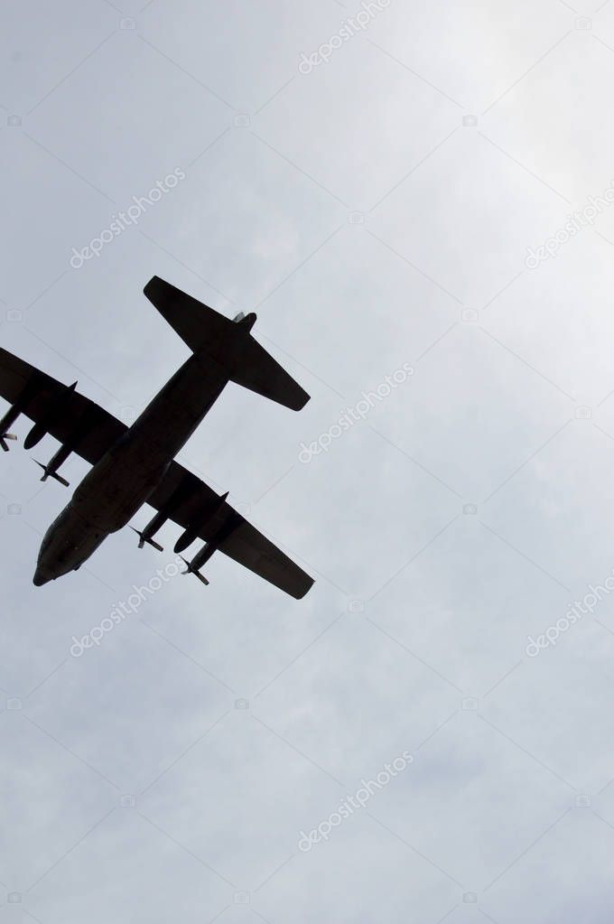 military aircraft hercules at the sky