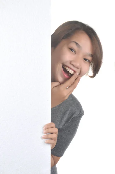 Alegre asiático menina com um branco bordo — Fotografia de Stock