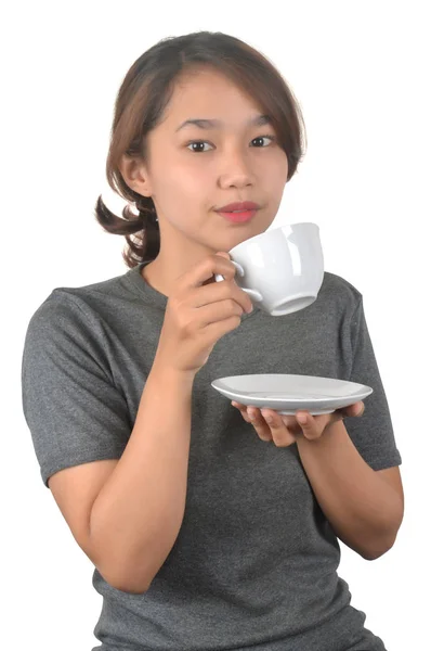 Asian girl drinks with a white cup — Stock Photo, Image