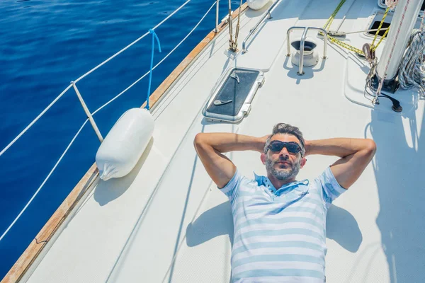 Man resting On Yacht in Greece