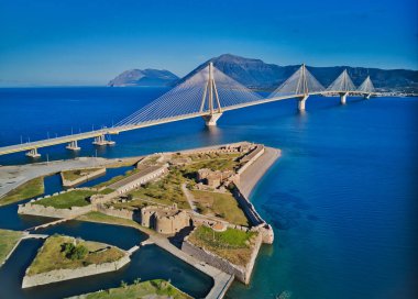 Fortress and bridge of Rio Antirio, Patra, Greece. Aerial drone birds eye view photo. clipart