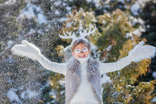 Smiling boy with funny antlers of a deer. Holiday concept. — Stock Photo, Image