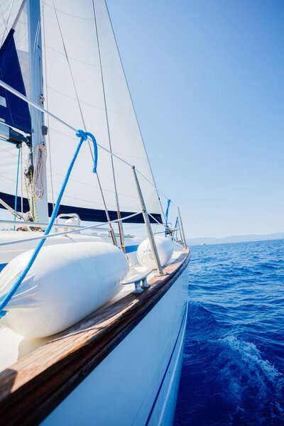 Sailing. Ship yachts with white sails in the open Sea.