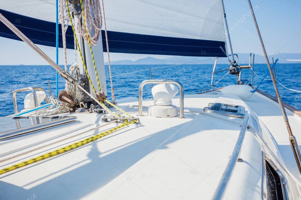 Sailing. Ship yachts with white sails in the open Sea.