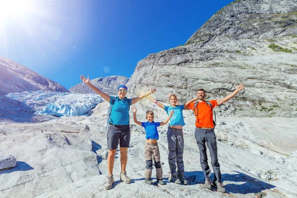 Family with two kids hiking in mountains, active travel — Stock Photo, Image