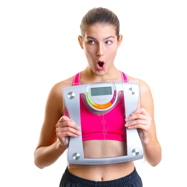 Beautiful young emotional girl holding scales, isolated — Stock Photo, Image