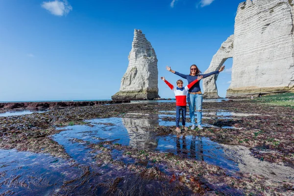 Happy mother with her son having fun in the Etretat. France — Stock Photo, Image