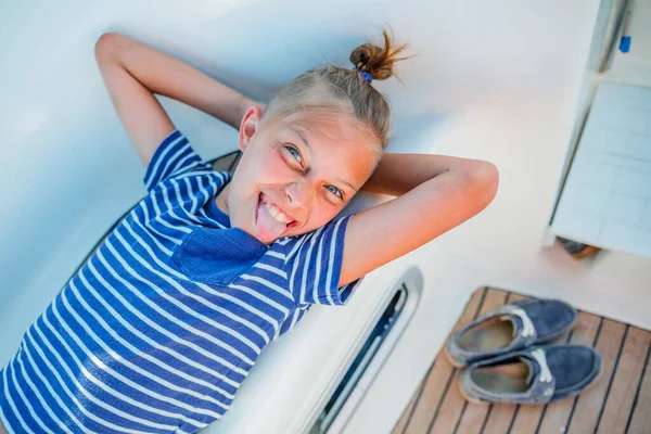 Little boy on board of sailing yacht on summer cruise. Travel adventure, yachting with child on family vacation. — Stock Photo, Image