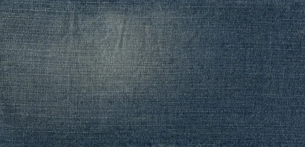 シームレスブルーデニムコットンジーンズ生地の質感の背景と壁紙 — ストック写真