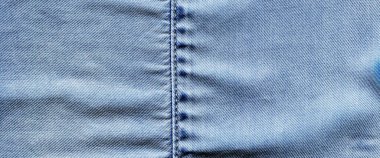 Dikilmiş açık mavi kot kot pantolon kumaş kumaş arka plan ve duvar kağıdı