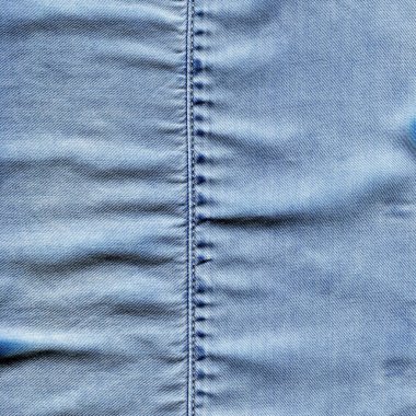 Dikilmiş açık mavi kot kot pantolon kumaş kumaş arka plan ve duvar kağıdı
