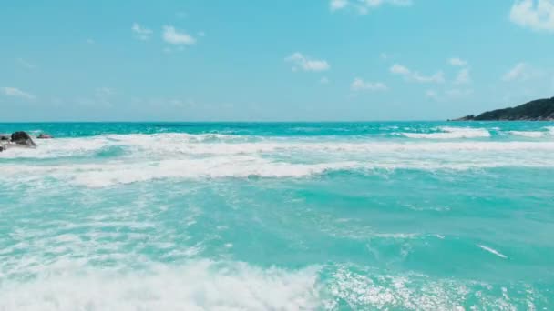 Drone flies backward over the sea waves — Stock Video