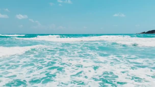 Blue skies over an ocean with waves aerial — Stock Video