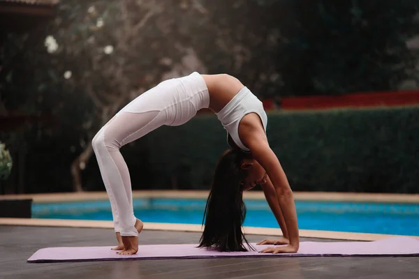 Asia Yoga instructor, in outdoor exercise