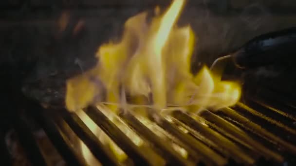 Steak slipping on the grill with fire slow mo — Stock Video