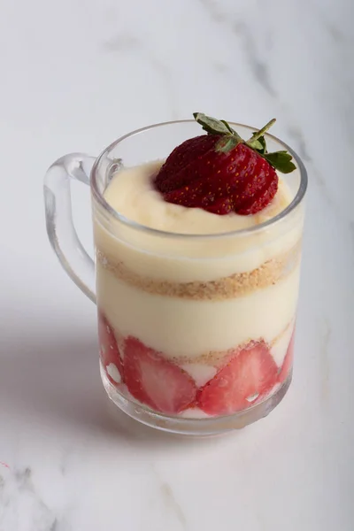Strawberry magnolia dessert in the cup over white backdrop — Stock Photo, Image