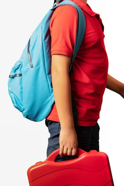 kid boy wearing backpack standing over isolated white background