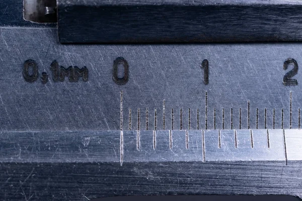 Vintage steel caliper tool closeup. Scale in focus. Tool in very — Stock Photo, Image
