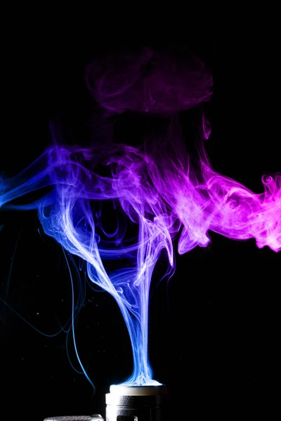 Colored clouds of vape smoke. A lot of colour and glicerine clouds, red and blue colours. Stock photo isolated on black background with boling spray of vaping liquid. Vape culture and no smoking movement. — Stock Photo, Image