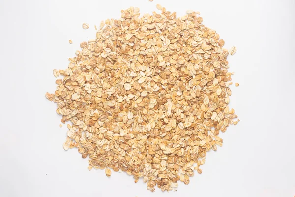 Granola closeup için tahıl gevreği. Beyaz sırtta izole edilmiş pullar — Stok fotoğraf