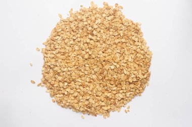 Granola closeup için tahıl gevreği. Beyaz sırtta izole edilmiş pullar